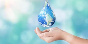 conserve water - 3 Easy Ways to Conserve Water in Your Home - cupped hands under an image of earth as a drop of water